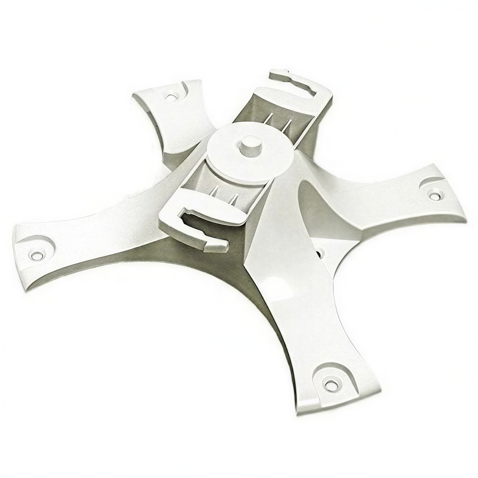 A white plastic object with a circular attachment, possibly a part of a larger assembly or device.