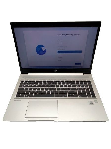 a silver laptop with a black keyboard and trackpad, displaying a screen with a question and answer interface.