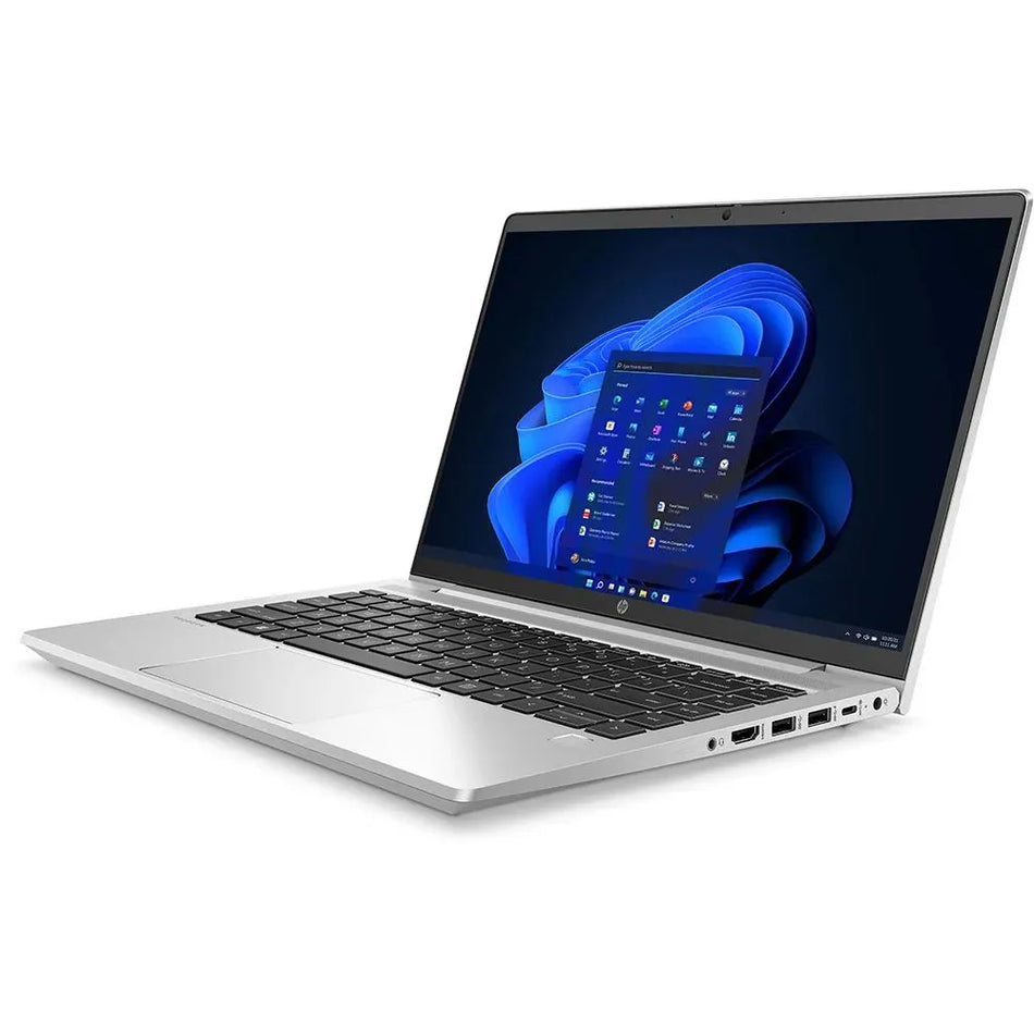 a silver laptop with a blue and white Windows operating system displayed on its screen.