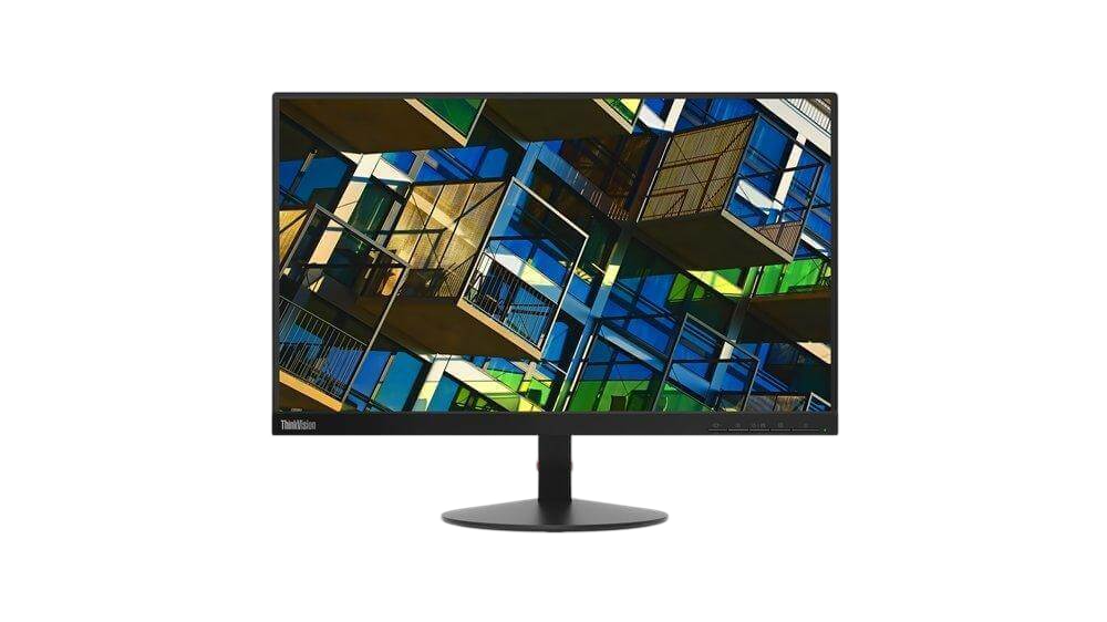 a computer monitor displaying a colorful, abstract image of a building with various geometric shapes and patterns.