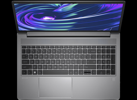 an open laptop with a silver keyboard and a large, colorful display screen.