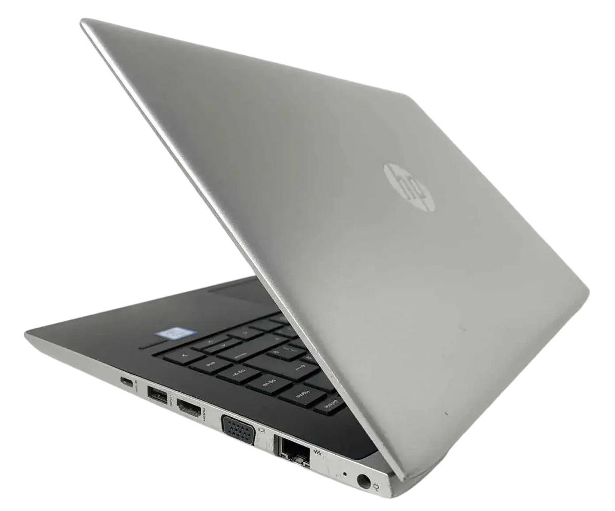 a silver HP laptop with its lid open, revealing the keyboard and other ports.