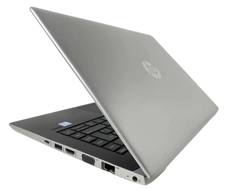 a silver HP laptop with its lid open, revealing the keyboard and other ports.