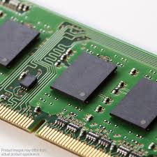 a close-up view of a green circuit board with various electronic components, including resistors and capacitors.