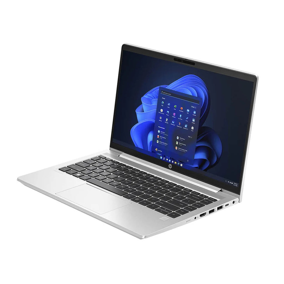 a silver laptop with a blue and white Windows operating system displayed on its screen.