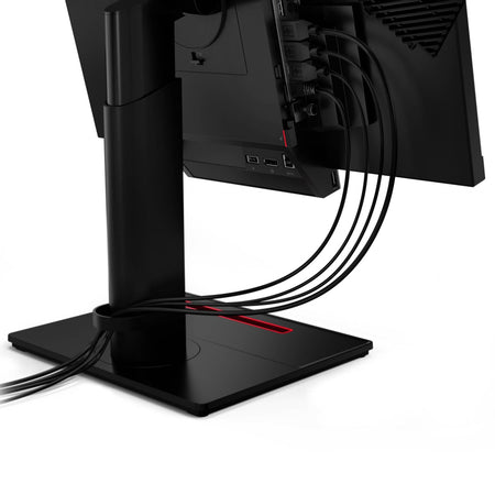 a computer monitor with multiple cables connected to it, indicating a multi-plug setup.