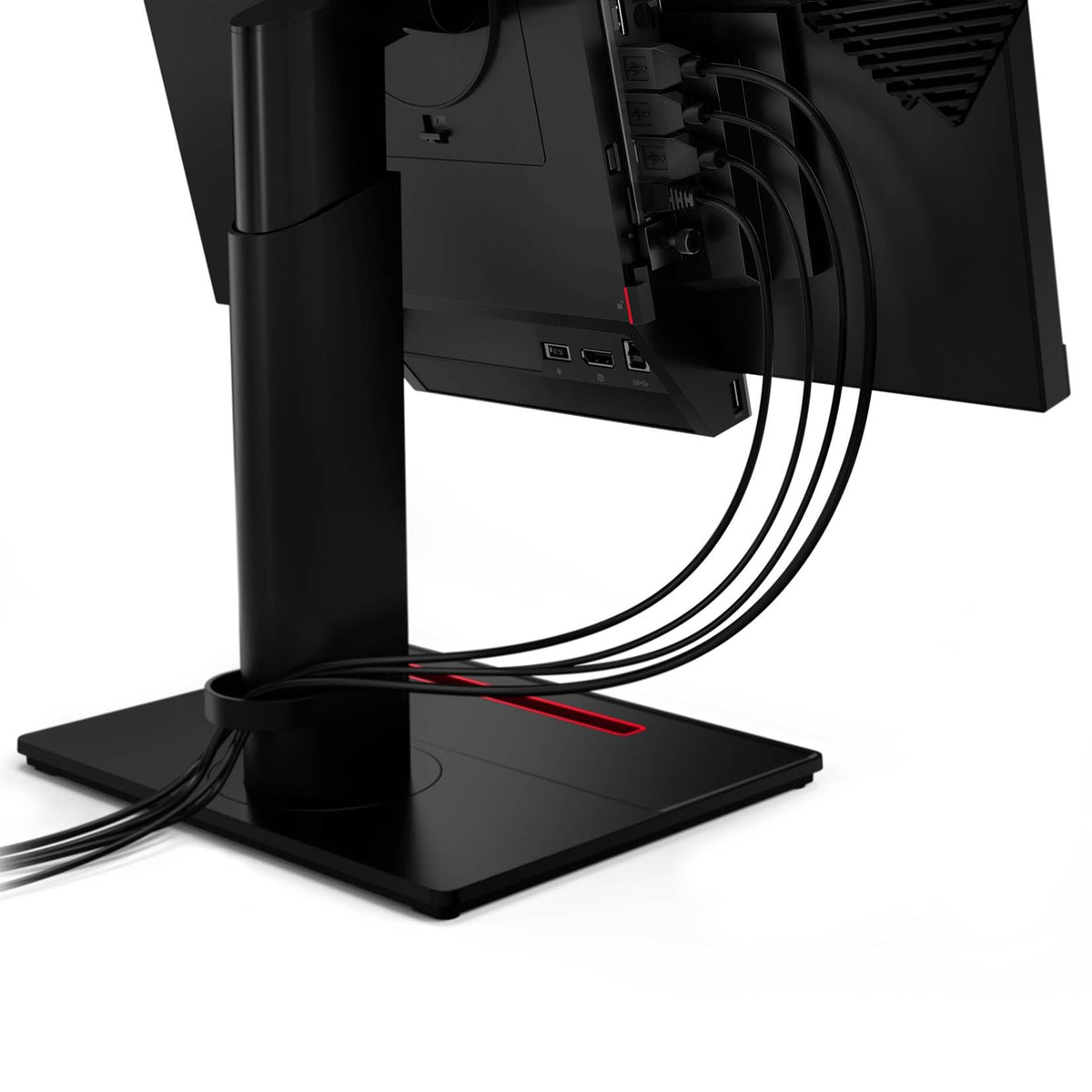 a computer monitor with multiple cables connected to it, indicating a multi-plug setup.