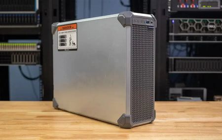 Dell PowerEdge T160 server with Intel Xeon E-2414, showcasing a robust design on a wooden table.